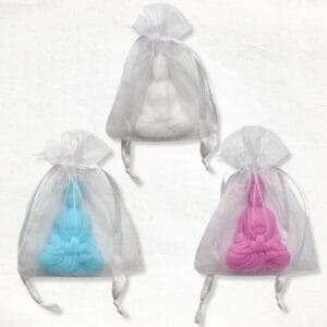 Buddha sitting cross-legged in an organza bag