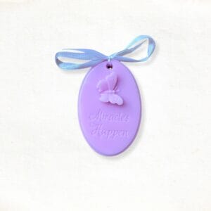 Label with text “Miracles happen” soap in pink